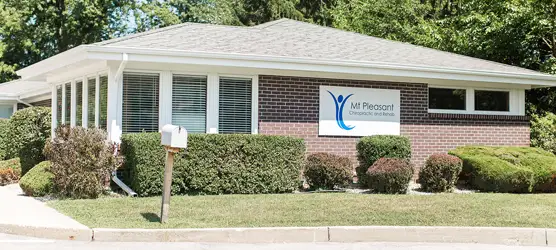 Outside of the office building. It is brick.